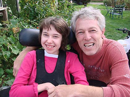 Jessica with her dad, smiling